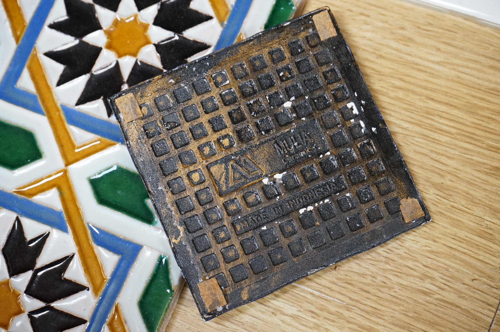 A collection of European tiles, to include a German rampant lion example, dishes and a Belgian bowl, largest 27cm in diameter. Condition - varies
